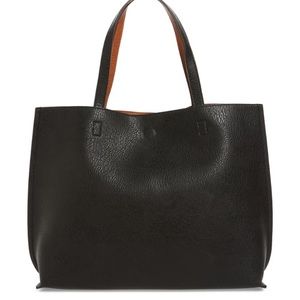 Reversible faux leather tote and wristlet